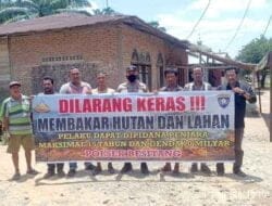 Bhabinkamtibmas Polsek Besitang Laksanakan Sosialisasi dan Pemasangan Spanduk Karhutla