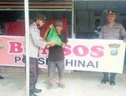 Polsek Hinai Laksanakan Giat Pembagian Bansos Kepada Warga Miskin
