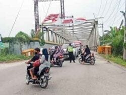 Patroli dan Pengaturan Lalu Lintas Sat Lantas Polres Langkat di Jembatan Wampu