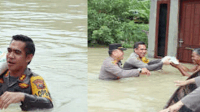 Salurkan Bantuan, Kapolres Batubara Pikul Beras Arungi Banjir